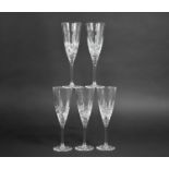 A Set of Five Cut Glass Champagne Glasses