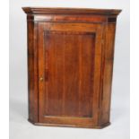 A 19th Century Oak Hanging Corner Cabinet with Panelled Door, 81cms Wide
