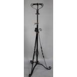 A Late Victorian Wrought Iron and Brass Adjustable Oil Lamp Stand on Tripod Scrolled Base