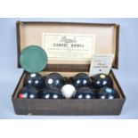 A Vintage Cased Set of Banda Carpet Bowls with Rules, Booklet and Mat