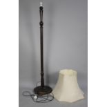 A Mid 20th century Standard Lamp with Turned Reeded Supports