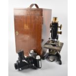 A Cased Edwardian Monocular Brass Mounted Microscope by Watson and Son, "The Service" together