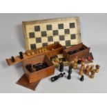 An Early 20th Century Turned Wooden Chess Set (Complete), Folding Chess Board and Various Draughts