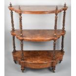 A Late Victorian Burr Walnut Three Tier Serpentine Front Whatnot with Barley Twist Supports and