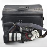 A Vintage Canon 3ccd Digital Video Camcorder with Case and Accessories