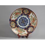 A Large Japanese Porcelain Charger Decorated in the Imari Palette with Central Floral Motif, 40cm
