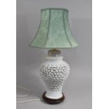 A Chinese Blanc De Chine Reticulated Vase Shaped Table Lamp, Complete with Shade, Overall Height