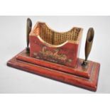 An Oriental Lacquered Desk Top Pen Rest with Centre Stationery Well and on Stepped Rectangular Base,