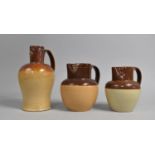 A Set of Three Late 19th/20th Century Glazed Stoneware Jugs to Include One Example Having Face