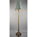 A Modern Brass Standard Lamp and Shade