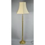 A Modern Brass Standard Lamp and Shade