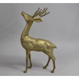 A Large Heavy Brass Study of a Stag with Head Raised, 30cm long and 54cm high