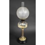 A Late Victorian Oil Lamp with Ribbed Brass Column Support, Plain Glass Reservoir, Etched Globe