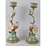 A Pair of Reproduction French Style Bronze and Porcelain Candlesticks in the Form of Birds Perched