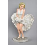 A Modern Painted Cast Iron Door Porter in the Form of Marilyn Monroe, 33.5cms High