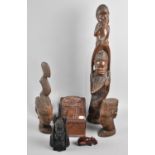 A Collection of African and Maori Carved Figural Souvenirs