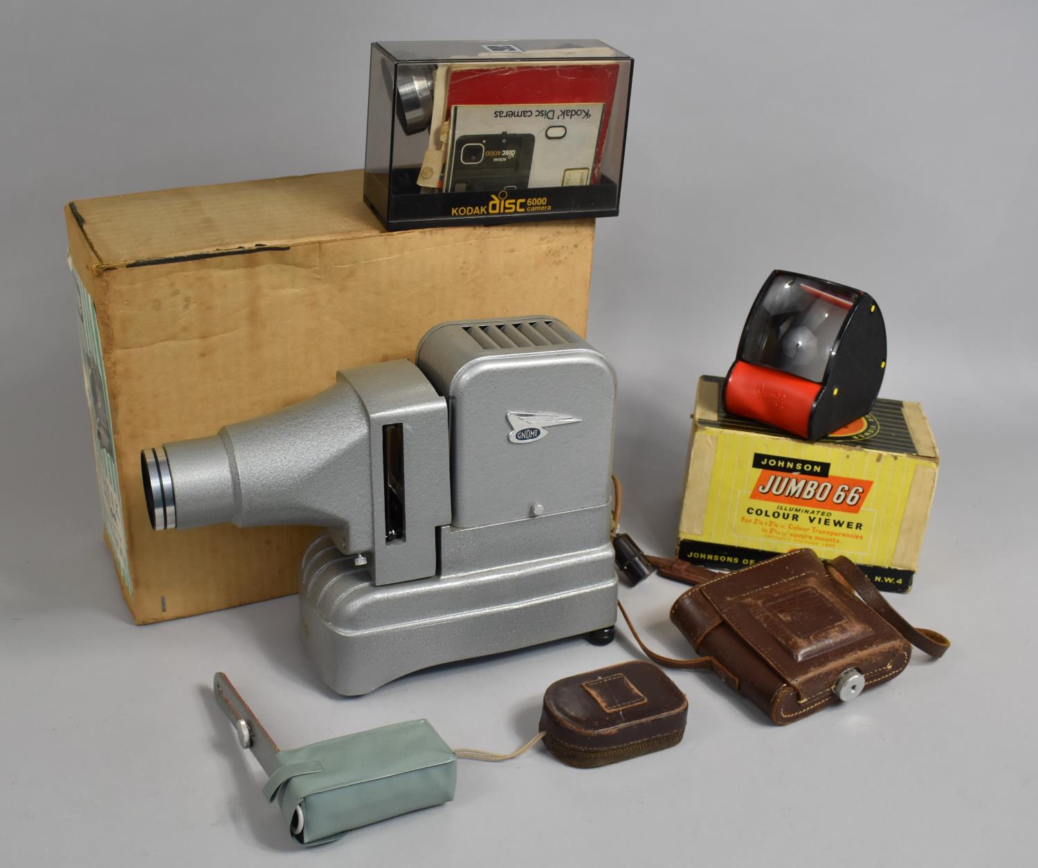 A Vintage Gnome Slide Projector, Kodak Disc Camera, Leather Cased Camera and Slide Viewer etc