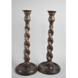 A Pair of Edwardian Oak Barley Twist Candlesticks, 36.5cms High