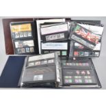 A Collection of Ring Binder Albums Containing British Stamp Sets and Presentation Packs