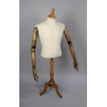 A Late 20th century Dressmaker's Display Mannequin with Articulated Wooden Arms, One Finger AF, on