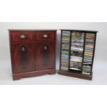 A Large Collection of DVDs and CDs inside 2 Modern Mahogany Stands