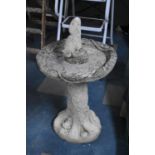 A Reconstituted Stone Garden Birdbath, 63cm high to Bowl, with Squirrel Finial