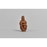 A 19th Century Chinese Carved Hediao Nut in the Form of an Eldar and Child, 4cms High