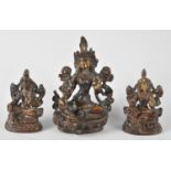 A Set of Three Small Patinated Bronze Buddhas on Lotus Thrones, Tallest 9cms High