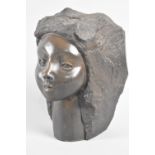 A Cast Resin Bronze Effect Sculpture of Girl Emerging From Rock, 19cms High