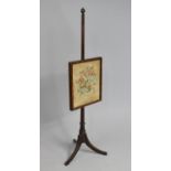 A 19th Century Rise and Fall Mahogany Miniature Table Top Pole Screen, 61cms High, Silk