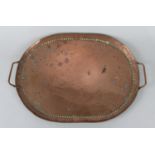 An Arts and Crafts Hand Beaten Copper Oval Two Handled Tray Stamped JP for John Pearson, 43cms Wide