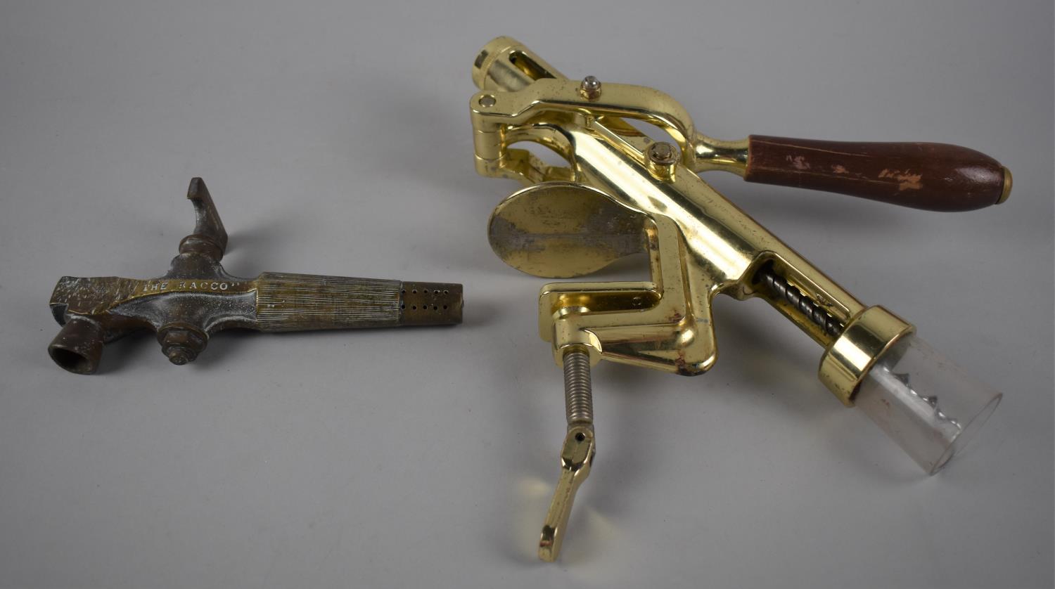 A Modern Brass Bar Mounting Automatic Corkscrew together with a Vintage Brass Barrel Tap