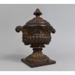 A Bronzed Cast Iron Two Handled Lidded Urn, 19th Century, 23cms High