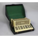 A Vintage Hohner Tango III Piano Accordion in Carrying Case