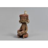 An Early Mexican Terracotta Figural Pipe in the Form of a Seated Gent with Headdress