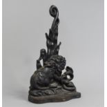 A 19th Century Black Painted Cast Iron Door Porter Depicting Lion and Snake, 37cms High