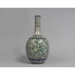 A Persian Bottle Vase with Floral Decoration in Green and Blue Enamels, 32cms High