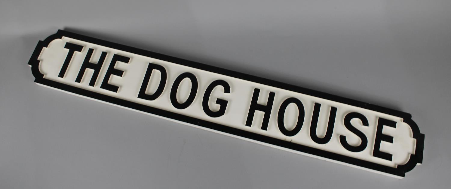 A Wooden Sign in the Form of a Cast Metal Road Sign, "The Dog House", 87cms Wide