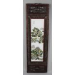 A Chinese Wooden Framed Porcelain Panel, 120cms by 36cms