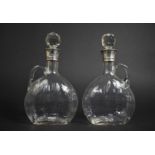 A Pair of Early 20th Century Silver Collared Glass Flasks Complete with Faceted Globular Stoppers,