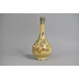 A Persian Glazed Bottle Vase with Garlic Bulb Top Decorated in Polychrome Enamels with Blossoming