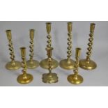 A Collection of Brass Barley Twist Candlesticks Together with a Single Early Knopped Example