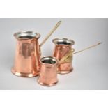 Three Reproduction Graduated Copper Cider Warmers with Brass Handles, Tallest 13cms High