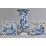 A Tin Glazed Delft Blue and White Vase Together with Two Blue and White Tin Glazed Tiles, Various