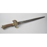 A Late 19th Century Saw Back Hunting Sword with Kidney Shaped Brass Guard Decorated with Lyre,