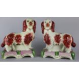 A Pair of Reproduction Staffordshire Spaniels, 24cms high