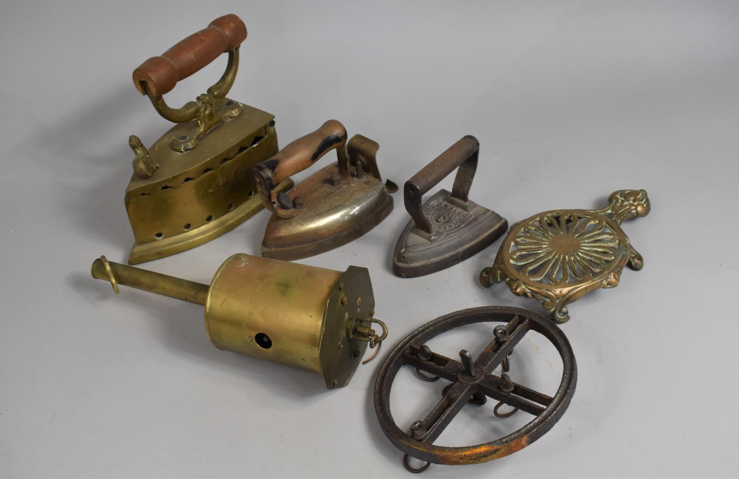 A Collection of Various Vintage Metalwares to Comprise Flat Irons, Meat Jack and a Cast and