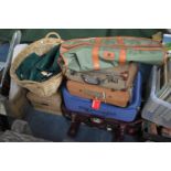 A Collection of Various Suitcases and Travel Bags, 42" Farm Overalls, Linens, Wicker Baskets Etc