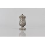 A Late 19th Century Indian Silver Pepper Pot with Scrolled Foliate Decoration. 8.5cms High