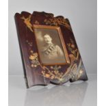A Late 19th/Early 20th Century Japanese Export Lacquer Photograph Frame, Decorated with Images of